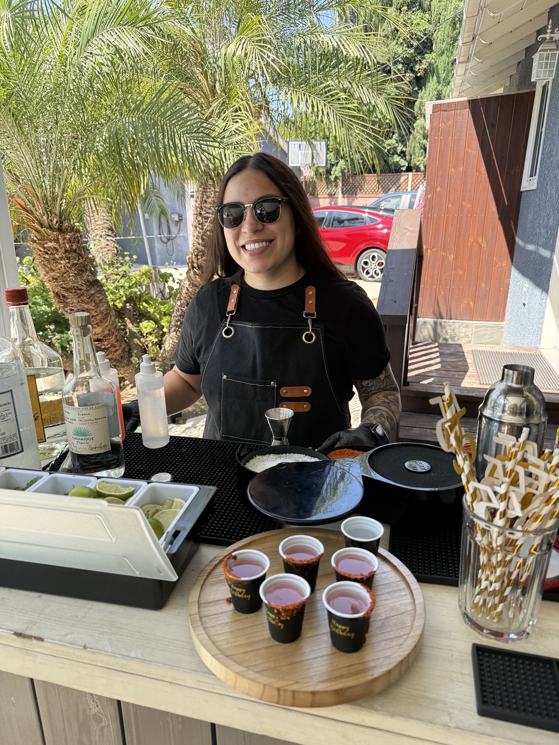 Alexis, co-owner of Elevated Mixers, bartending at an event
